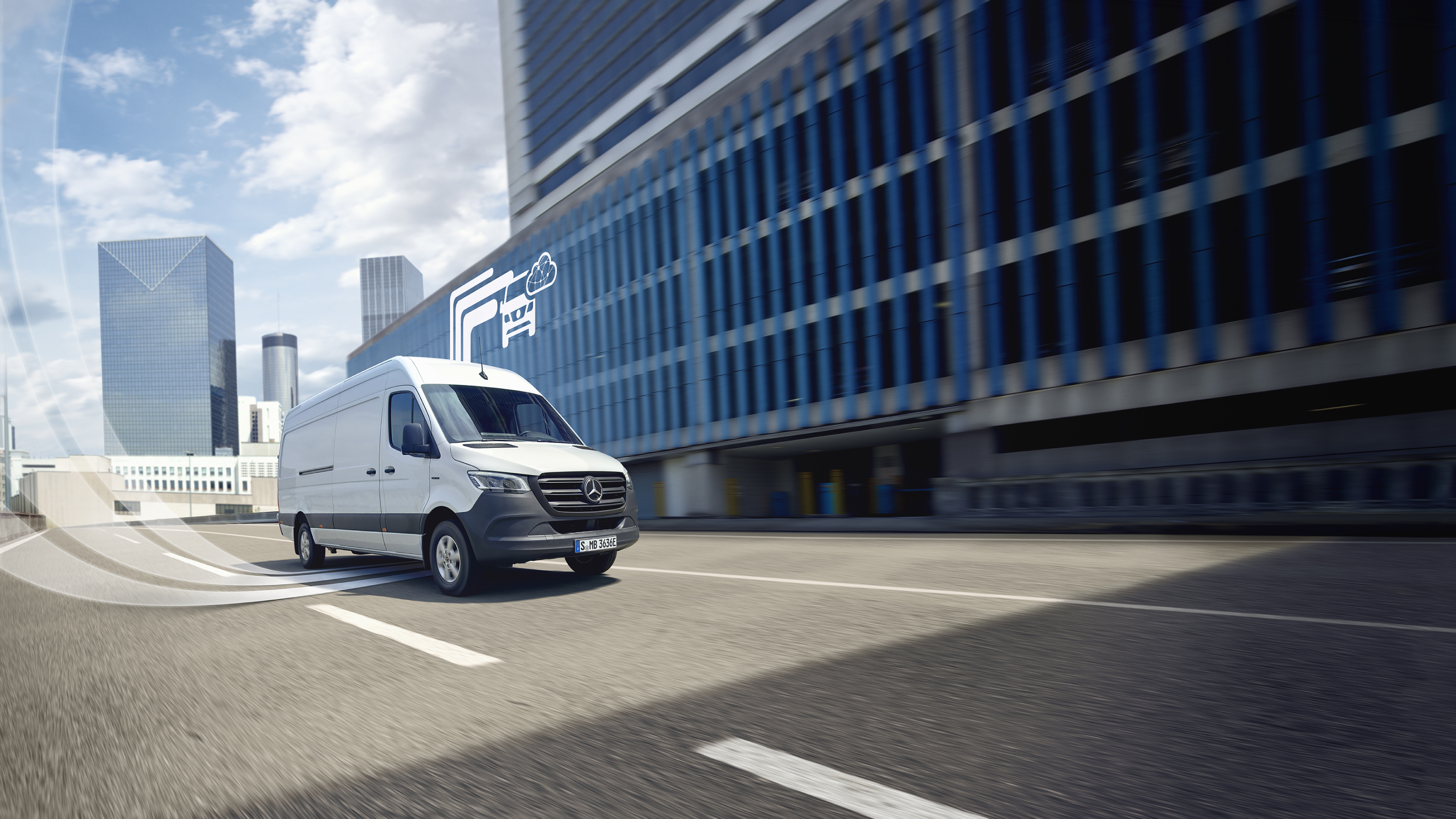 Offres digitales | Mercedes-Benz Un utilitaire léger Mercedes-Benz avec des éléments graphiques représentant les offres digitales.